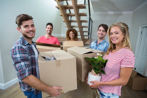 Professional packing and unpacking service preparing boxes in a Balham home