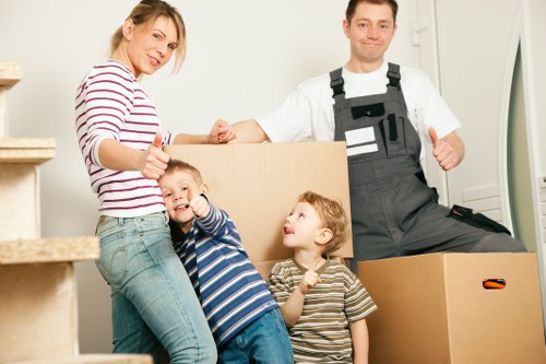 House removalists in Balham loading furniture and packed boxes into a removal vehicle